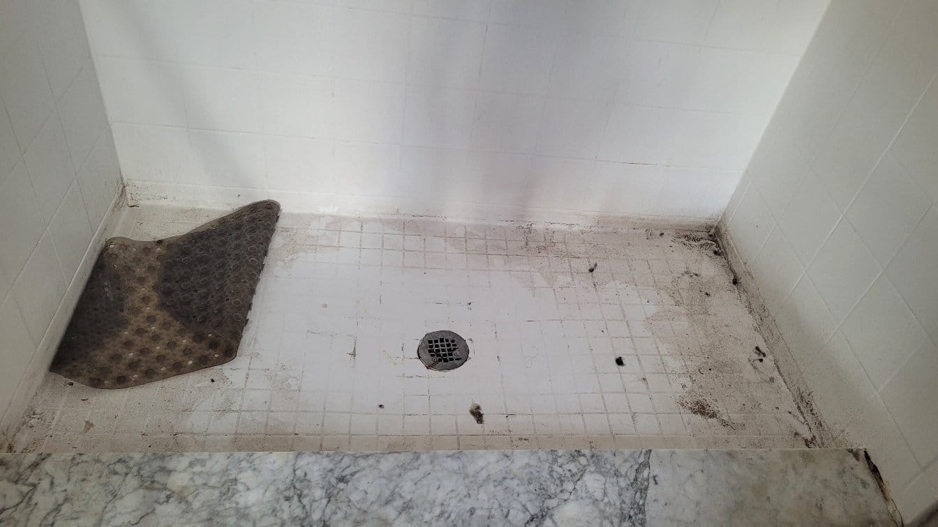 Shower floor before cleaning